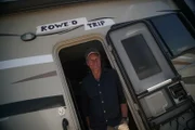 Mike Rowe, host of Dirty Jobs, poses with the Rowe'd Trip RV.