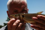 Jeremy holding fish on Parana river north of Bella Vista.