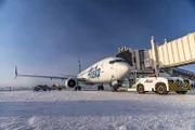 Alaska Airlines airplane with jetbridge