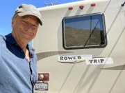 Mike Rowe poses with the Rowe'd Trip RV.