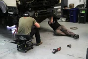 HD and Joel work on the underbelly of the Overlander