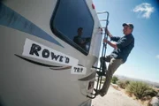 Mike Rowe, host of Dirty Jobs, poses with the Rowe'd Trip RV.