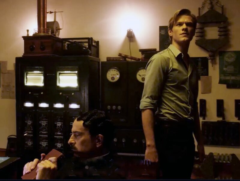 L-R: Nikola Tesla (John Ales), Angus MacGyver (Lucas Till)