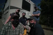 The crew of Dirty Jobs poses with the Rowe'd Trip RV while filming Dirty Jobs. From left to right, David Barsky, Troy Paff, Chris Jones, Mike Rowe and Doug Glover