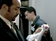 Detective Ed Green (Jesse L. Martin)