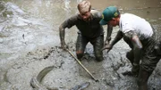 L-R: Robert and Toby catching another alligator.