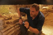 Josh admires the ruins of the Temple of Claudius which Boudica and her army destroyed and killed the residents in Colchester, England.