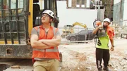 Dalton in foreground contemplate dangerous wall with worker in background Central Auckland Old night club building demolition