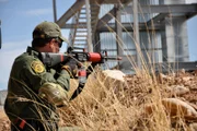 Nogales, Arizona, USA: Customs and border protection Agent Pittman practices shooting with his gun. Agents must train to prepare themselves for fights with drug smugglers and cartels.