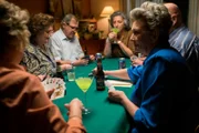 Neighbors gathered while playing cards.