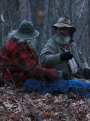 Trapper and the team taking a break and discussing their plan.