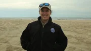 Jennifer Provaznik smiling on the beach.