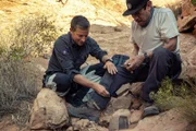 Bear Grylls shows Danny Trejo how to start a fire. (National Geographic/Ben Simms)