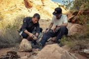 Bear Grylls shows Danny Trejo how to start a fire. (National Geographic/Ben Simms)