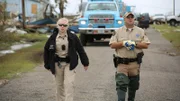 Wardens Miller and May search the devastated street.