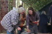 Billy Brown and Bam Brown serving themselves food. Rain Brown standing with them, Ami Brown behind them.