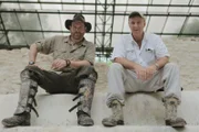 L-R: Josh Gates and Dr. Richard Hansen at the Temple of the Jaguar Paw Ruins in El Mirador, Guatemala.