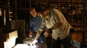 Josh and Coy Lothrop read the plaques of a removed monument in the Municipal Warehouse of Charleston, South Carolina.