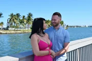 Russ and Paola smile as they pose for their hero shots.