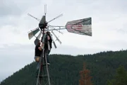 The Brown Family works on windmill disassembly.