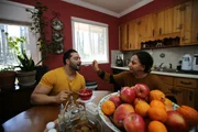 Laila spoon feeds Shekeb.