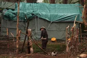 Noah Brown working near trapper shack.