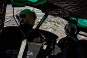 El Paso, TX: Agents flying in their helicopter. Helicopters play an important role for the Customs and Border Protection agency, helping agents locate where criminal activity is about to occur.