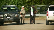 Hunting warden Justin Eddins secures the scene of the accident so that no onlookers are harmed there.