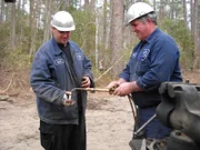 Justin helping Bobby get the blow torch lit.