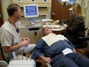 Bobby gets a briefing as they prepare to work on his teeth.