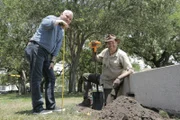 Josh and Coy Lothrop dig for treasure at White Point Gardens in Charleston, South Carolina.