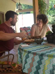 GEOFFREY and OLGA having tea.