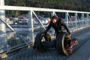 Gabe rolls Matt down ramp in tires.