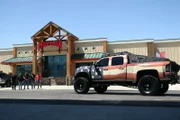 Maverik exterior with Truck Norris truck and (L-R) Nitro, Chuck Norris, Josh Stewart, Keaton Hoskins, and Dave Kiley.