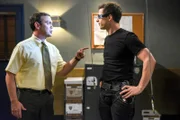 (l-r) Joe Lo Truglio as Charles Boyle, Andy Samberg as Jake Peralta