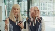 L-R: Jasmyn (Sarah Nauta), Anika Hunter (Kyra Isako Smith)