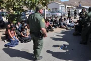 SAN DIEGO, CA, USA: Border patrol agents apprehend illegal immigrants attempting to cross into this area of San Diego, California in trunks, under the dash, and in engine compartments. This San Ysidro border crossing is the busiest in the world, with over 40 million people entering the U.S. through this port in 2005 alone.