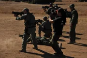 SAN DIEGO, CA, USA: Border patrol agents perform weapons training. Several new "breakthrough" training systems allow the user to actually train in the field under real conditions, better preparing the agents to defend themselves against potentially dangerous drug traffickers.