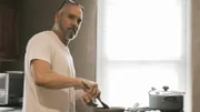 Grant Cardone cooking at his stove.