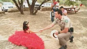 Game Warden with a little girl in a red dress.