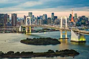 Tokyo, Japan skyline with Rainbow Bridge and Tokyo Tower.