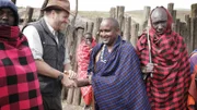 Josh shakes hands with Maasai Chief Batnoti Tipileit outside the Maasai village in Tanzania, Africa.