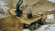 In order to treat polluted resources, the men are digging a third sedimentation basin in Montana, in which the silt sinks to the bottom.