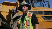 Casey Morgan standing in front of Rock Truck