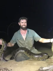 Forrest Galante Sitting In The Mud With The Anaconda