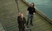 L-R: Matthew and Bear Brown on dock, waiting to haul fuel drum up onto the Integrity.