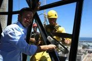 Picture shows: Giles Coren helps Monica Galetti window clean at The Silo, Cape Town