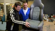 Mike Brewer inspects the Porsche seat.