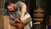 Travis pouring mash in his still