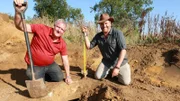 L-R: Military Historian Gary Sterne and Josh find a WWII machine gun nest at Maisy Battery, France.